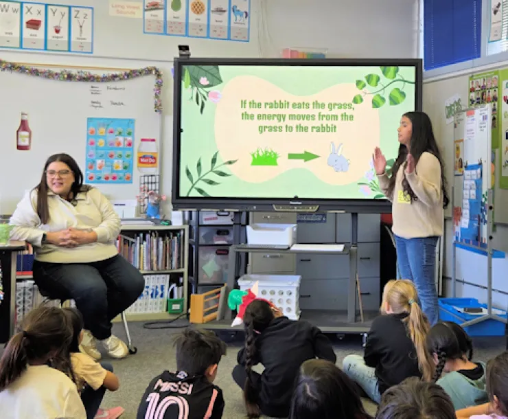 Intern teaching climate lesson to 2nd graders