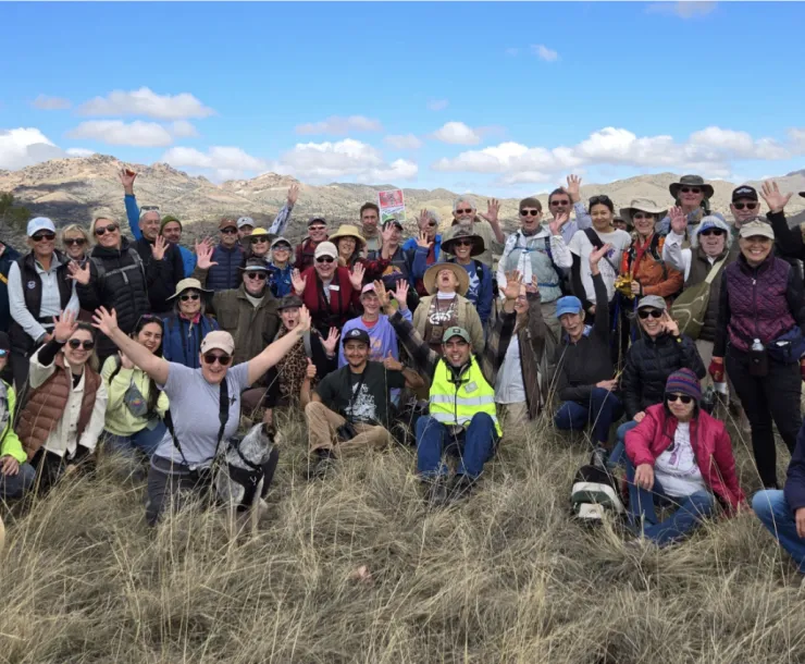 A large group poses for a photo in the Santa Rita mountains