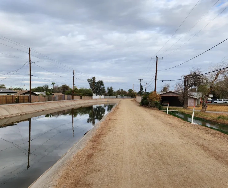 a canal and a dirt path