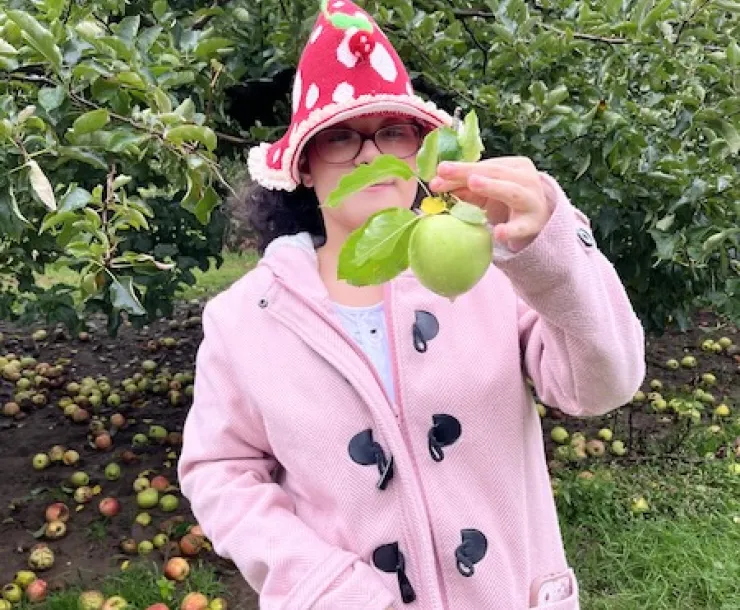 Student apple picking. 