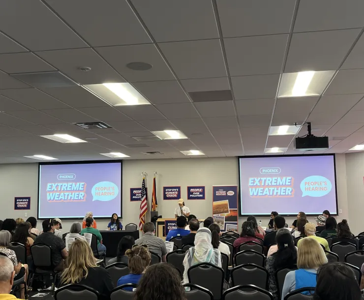 A crowd facing a stage