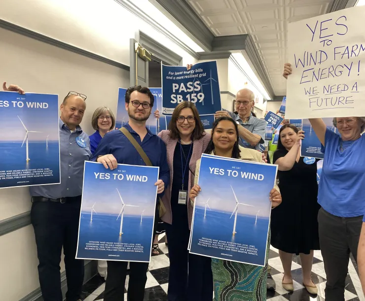 picture of sierra club advocates with Rep. Claire Snyder Hall on June 30th 2025 with Yes on Wind signs