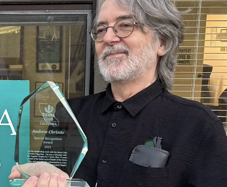 Andrew Christie holding special recognition award from Sierra Club California - cropped