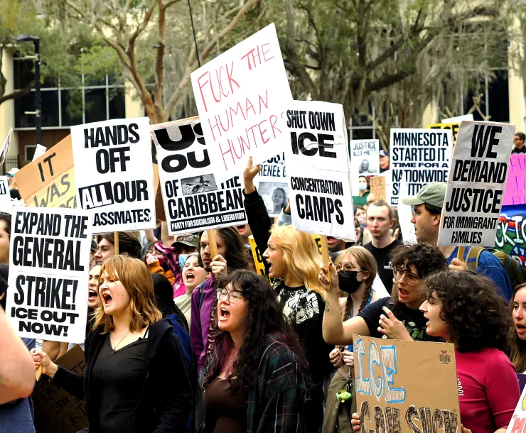 Student protesters holding signs opposing ICE and demanding a General Strike