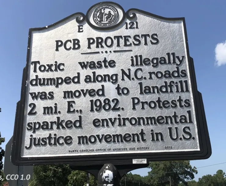 A historic marker sign denotes the location of protests in Warren County, NC, that sparked the environmental justice movement