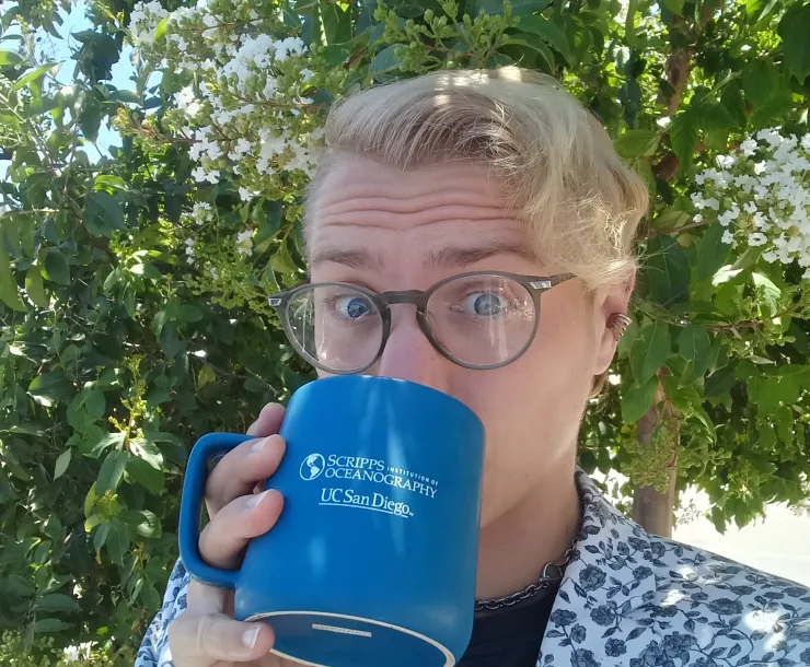 Chapter Executive Committee member Jack DePuy holding a coffee cup