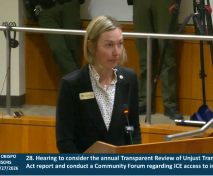 Woman at podium testifying to the SLO County Board of Supervisors