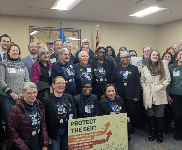 image of people holding a sign 