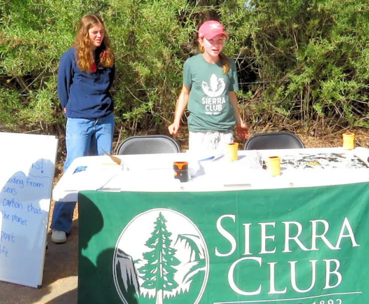 Two interns addressing students