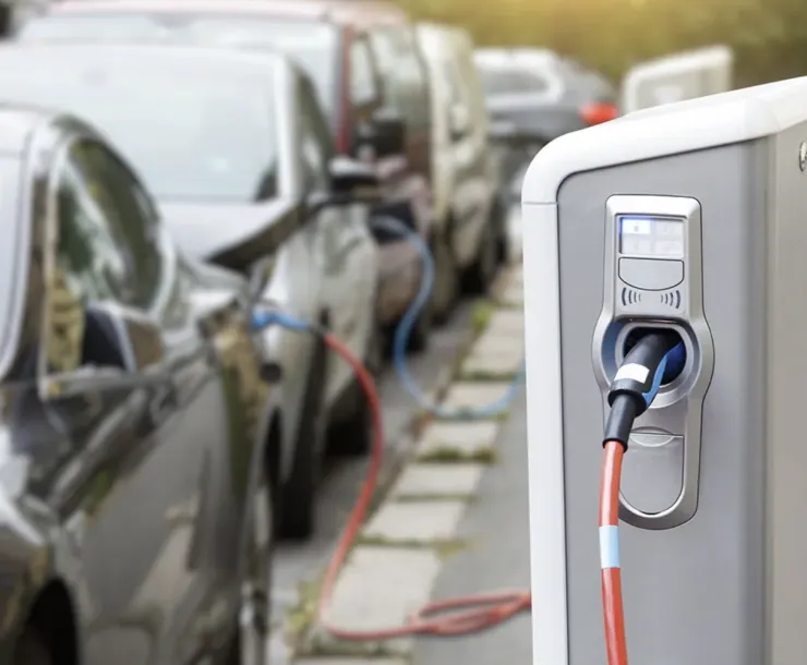 image of electric vehicles connected to an electric vehicle charging station 