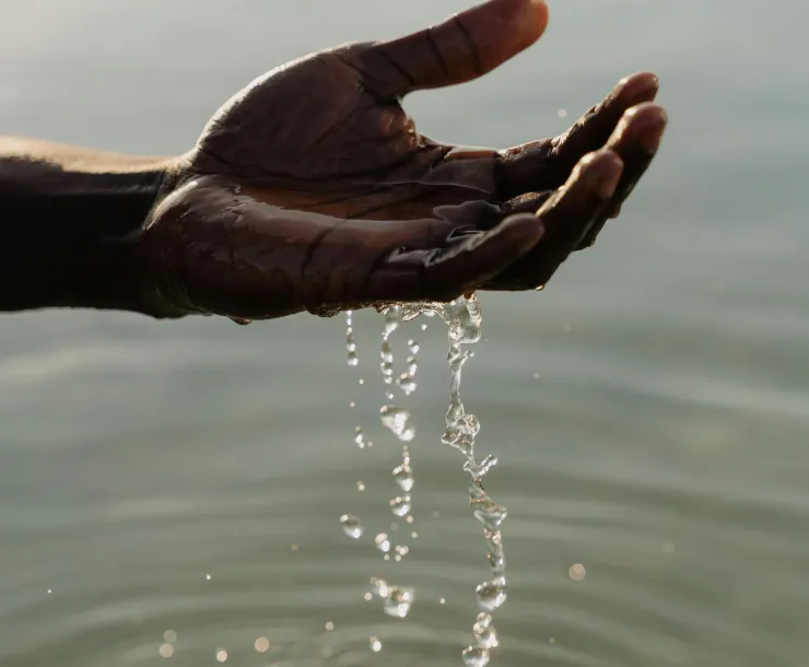 hand scooping water