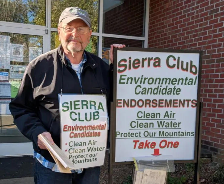 Sierra Club member Steve Thomas hands out endorsement cards outside of a voting site in Buncombe County.