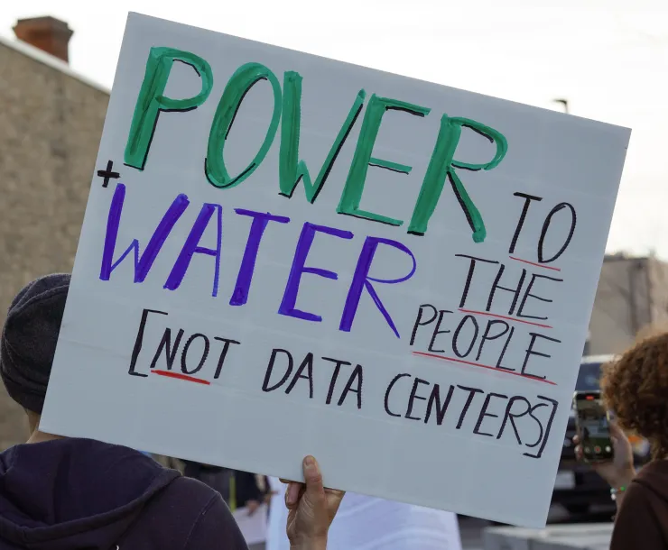 protest sign that says Power plus water to the people, not data centers