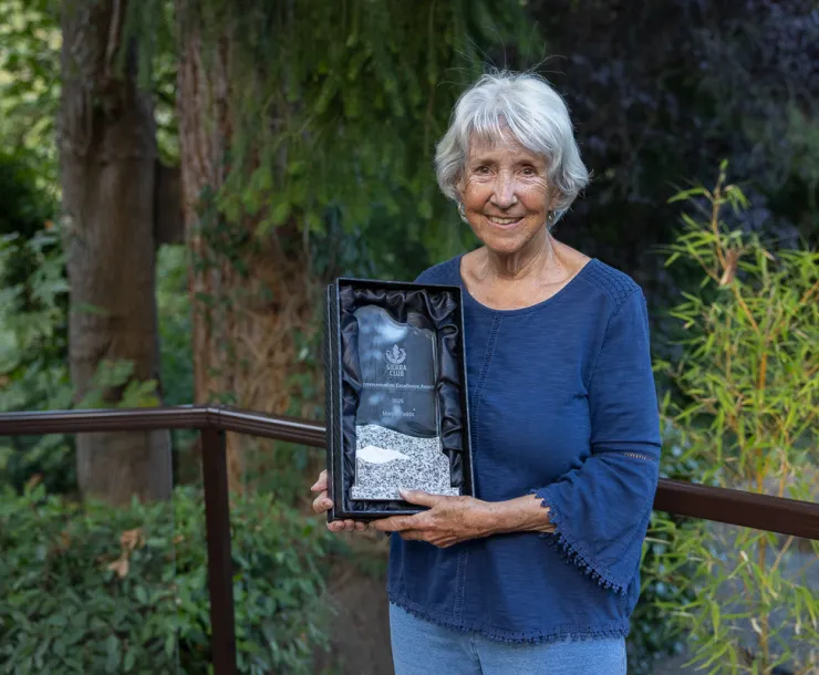 Marjie Fields holding her award