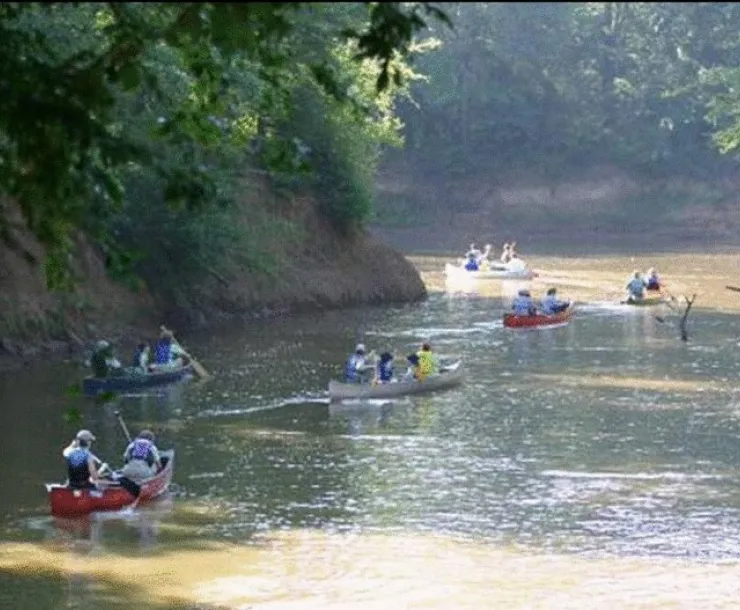 CHP-TX-1900-CanoesHeadingDownRiver.jpg