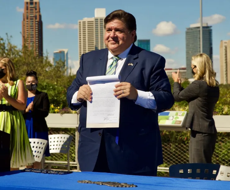 Pritzger signing CEJA.png