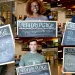 Students hold Earth Day Pledge signs that say "Ride Bike to School," "Spend more time with nature," "Do more bottle runs," and "Walk to work every day."
