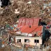 A sign for help is seen amid the destruction left from Typhoon Haiyan in the coastal town of Tanawan, central Philippines