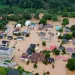 Aerial view shows the roofs of homes and buildings submerged in brown floodwaters in Jackson, Kentucky.