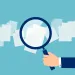 Magnifying glass over documents