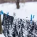 Snow-covered clothes on a clothesline. Photo by Kateryna Kukota | iStock.