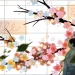  Illustration shows a page of a calendar with the back of a person and a cherry blossom branch falling across the page.