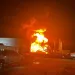 This image provided by Louisiana State Police shows a fire at a storage tank containing volatile naptha in Lake Charles, La., on Saturday night, June 3, 2023.