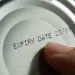 A can of food showing the expiration date