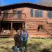 Diamon Clark and Kristen Walker stand in front of the cabin they stayed at for their visit to Shenandoah National Park.
