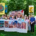 Clean Air Activists gather outside of the Salt Lake City Hall for a picture with all of the signage they brought into their meeting with EPA