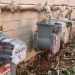 Xcel gas meters on the side of a multi-unit home.