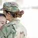 Active Duty Military Personnel kissing son goodbye