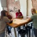 Senior Campaign Strategist Lornett Vestal facilitates a conversation at a table of three participating veterans at the Augusta stop of the Sierra Club Military Outdoors listening session series.