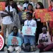 Vanessa Nakate, of Uganda, center, takes part in a protest against fossil fuels at the COP28 U.N. Climate Summit, Tuesday, Dec. 5, 2023, in Dubai, United Arab Emirates.