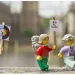 lego characters holding signs