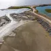 A tidal marsh meeting the Pacific Ocean