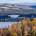 Aerial photo of Superior National Forest with fall colors and set against lake shores