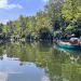 A man paddles a canoe down Indianapolis' White River