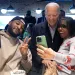 President Joe Biden, center, takes photos with patrons at They Say restaurant during a campaign stop