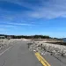 Asphalt from a road is missing after a storm.