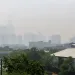 The downtown skyline and the iconic Willis Tower obscured by heavy smog.