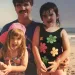 Two sisters and their dad at the beach.
