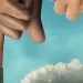 Illustration shows four white smokestacks and two hands with one finger blocking two of the smokestacks