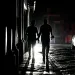 People walk through San Juan during a power outage.