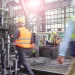 Blurred factory workers