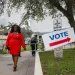 A woman walking on her way to voting