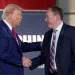Republican presidential nominee former President Donald Trump greets Lee Zeldin as he arrives to speak at a campaign event at a farm