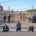 Janie Cisneros (left), who leads Singleton United/Unidos sits with four others in front of GAF on Earth Day 2024. The action was planned to raise awareness for a campaign aimed at closing the plant down. The shingles factory is one of the largest polluters in Dallas and has generationally affected the West Dallas neighborhood it operates in. | Photo by Johnathan Johnson 