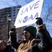 Demonstrators attend rally outside National Oceanic and Atmospheric Administration headquarters to oppose the recent worker firings, in Silver Spring, Maryland.