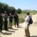 a group of people listen to a speaker at an outing
